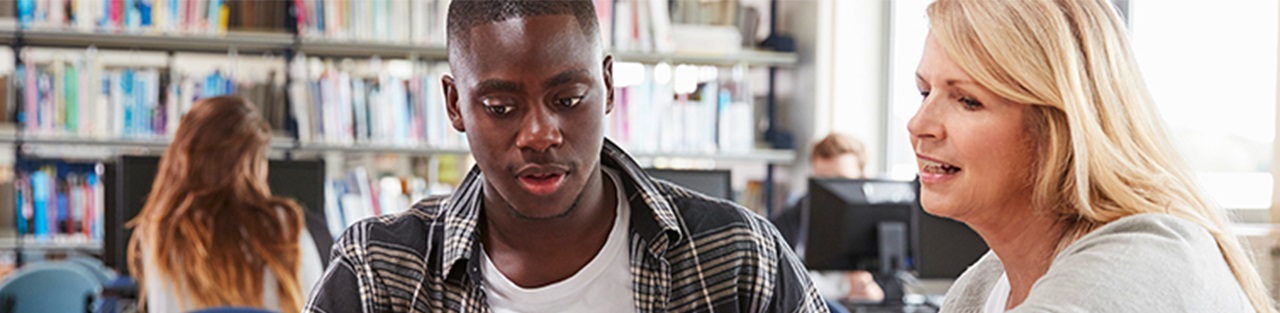 Students discussing in library