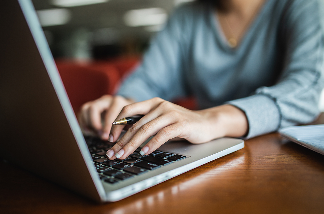 a women hands on laptop